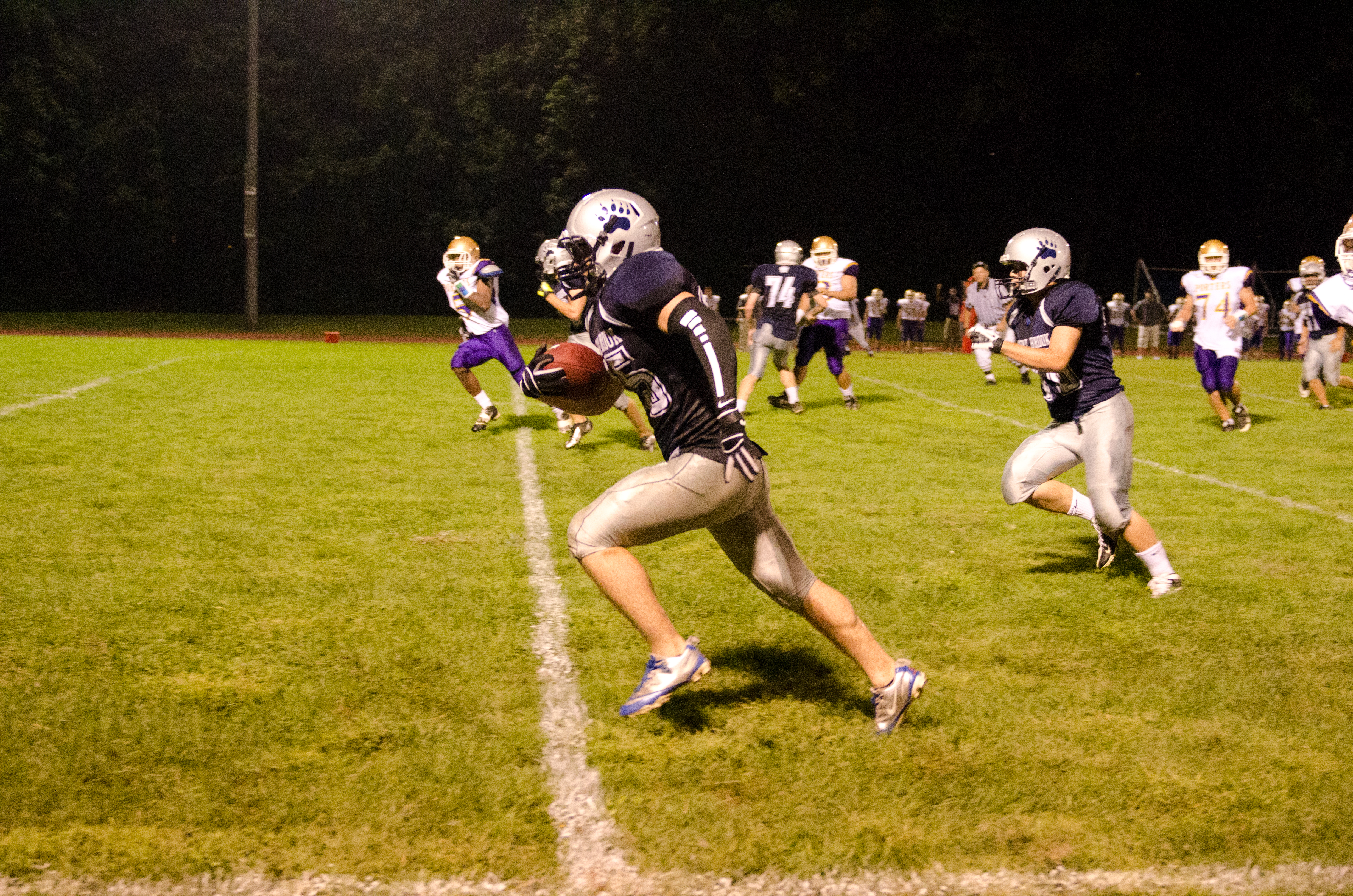 Liotine charges up the sideline for one of his four scores (Photo credit: Bruce Jeffrey)