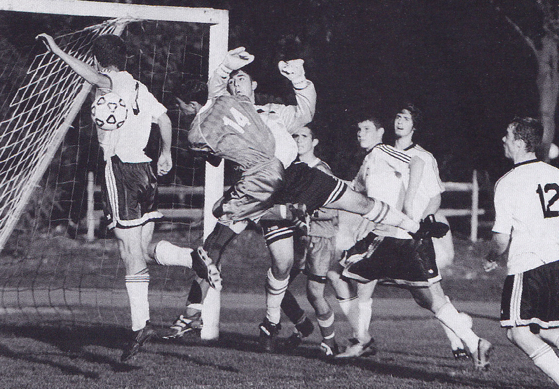 Hicks (#3) & Rulli defend the goal